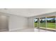 Gathering room featuring sliding glass doors opening to a grassy backyard at 4322 Silo Port Ct, Lakewood Ranch, FL 34211
