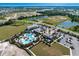 Aerial view of community pool, clubhouse, and surrounding landscape at 4322 Silo Port Ct, Lakewood Ranch, FL 34211