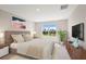 Bright bedroom with a comfortable bed and plenty of natural light at 4322 Silo Port Ct, Lakewood Ranch, FL 34211