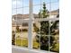 Window view showcasing the neighborhood's tree-lined streets and homes at 4322 Silo Port Ct, Lakewood Ranch, FL 34211