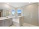 Modern bathroom with soaking tub, walk-in shower, and double vanity at 4322 Silo Port Ct, Lakewood Ranch, FL 34211