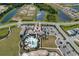Aerial view of community pool, clubhouse, and surrounding landscape at 4322 Silo Port Ct, Lakewood Ranch, FL 34211