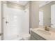 Clean bathroom with white tiled shower and gray vanity at 4322 Silo Port Ct, Lakewood Ranch, FL 34211