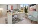 Bright home office features a large desk, comfortable chair, and natural light at 4322 Silo Port Ct, Lakewood Ranch, FL 34211