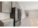 Modern kitchen with stainless steel refrigerator and gray cabinets at 4322 Silo Port Ct, Lakewood Ranch, FL 34211