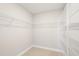 Large walk-in closet with wire shelving and hanging rods at 4322 Silo Port Ct, Lakewood Ranch, FL 34211