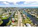 Wide aerial showcasing the property's canal-front location and neighborhood at 21288 Edgewater Dr, Port Charlotte, FL 33952