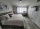 Spacious main bedroom with a king-size bed and a built-in workspace at 4629 Sabal Key Dr # 4629, Bradenton, FL 34203