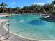 Community swimming pool with a spacious deck at 4629 Sabal Key Dr # 4629, Bradenton, FL 34203