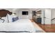 Main bedroom with built-in kitchenette and hardwood floors at 501 Harbor Point Rd, Longboat Key, FL 34228