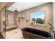 Large bathroom with walk-in shower and copper tub at 501 Harbor Point Rd, Longboat Key, FL 34228