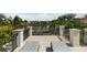 Private rooftop terrace with water views and lounge chairs at 501 Harbor Point Rd, Longboat Key, FL 34228