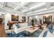 Elegant living room with coffered ceiling, hardwood floors, and comfortable seating at 501 Harbor Point Rd, Longboat Key, FL 34228