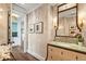 Elegant powder room with green marble vanity and decorative mirror at 501 Harbor Point Rd, Longboat Key, FL 34228