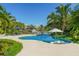 Resort style pool with lounge chairs and umbrellas at 501 Harbor Point Rd, Longboat Key, FL 34228