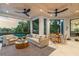 Relaxing screened porch with comfortable seating and beautiful water views at 501 Harbor Point Rd, Longboat Key, FL 34228