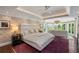 Spacious main bedroom with sitting area and water views at 501 Harbor Point Rd, Longboat Key, FL 34228