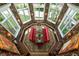 Octagonal dining room with botanical wallpaper, chandelier, and seating at 501 Harbor Point Rd, Longboat Key, FL 34228