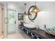 Elegant bathroom with a freestanding soaking tub, walk-in shower, and modern fixtures at 501 Harbor Point Rd, Longboat Key, FL 34228
