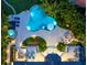 Luxury home with an expansive pool and lush landscaping at 501 Harbor Point Rd, Longboat Key, FL 34228