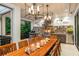 Beautiful outdoor kitchen with stainless steel appliances and a large dining table at 501 Harbor Point Rd, Longboat Key, FL 34228