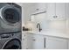 Bright laundry room with modern appliances at 501 Harbor Point Rd, Longboat Key, FL 34228