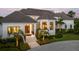 Elegant home exterior with a grand entrance and landscaping at 501 Harbor Point Rd, Longboat Key, FL 34228