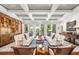 Spacious living room with coffered ceiling, hardwood floors, and comfortable seating at 501 Harbor Point Rd, Longboat Key, FL 34228