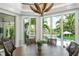 Bright breakfast nook with water views and seating for six at 501 Harbor Point Rd, Longboat Key, FL 34228