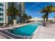 Resort-style pool with plenty of lounge chairs at 800 N Tamiami Trl # 1412, Sarasota, FL 34236