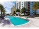 Resort-style pool with plenty of lounge chairs at 800 N Tamiami Trl # 1412, Sarasota, FL 34236