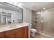Bathroom with single vanity and a walk-in shower at 800 N Tamiami Trl # 1412, Sarasota, FL 34236