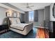 Bright bedroom with hardwood floors and modern furniture at 800 N Tamiami Trl # 1412, Sarasota, FL 34236
