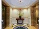 Lobby with two elevators and a decorative table at 800 N Tamiami Trl # 1412, Sarasota, FL 34236