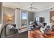 Living room with hardwood floors, balcony access, and city views at 800 N Tamiami Trl # 1412, Sarasota, FL 34236