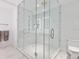 Modern bathroom with a large glass shower, white tile, and sleek fixtures at 111 S Pineapple Ave # 605, Sarasota, FL 34236