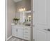 Clean and functional bathroom featuring a single vanity with a white countertop and neutral wall color at 16215 Tradewind Ter, Lakewood Ranch, FL 34211