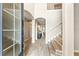 Grand foyer featuring wood-look tile floors, archways, staircase and an open view into other rooms of the home at 16215 Tradewind Ter, Lakewood Ranch, FL 34211