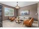 Comfortable living room featuring neutral colors, stylish furnishings, a window and a decorative light fixture at 16215 Tradewind Ter, Lakewood Ranch, FL 34211