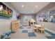 Bright and cheerful playroom equipped with toys, seating, and TVs for to enjoy at 16215 Tradewind Ter, Lakewood Ranch, FL 34211