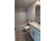 Bathroom featuring a vanity, toilet, and bathtub with tile surround at 2132 Nordendale Blvd, North Port, FL 34288