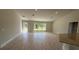 Spacious living room with recessed lighting, a large window, and wood-look tile flooring at 2132 Nordendale Blvd, North Port, FL 34288