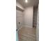 Walk-in pantry with shelving and wood-look tile flooring at 2132 Nordendale Blvd, North Port, FL 34288