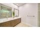 Modern bathroom with double vanity and large mirrors at 3920 Roberts Point Rd, Sarasota, FL 34242