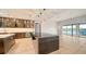 Open concept kitchen with island, modern cabinets, and water views at 3920 Roberts Point Rd, Sarasota, FL 34242