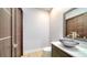 Powder room with a modern sink and toilet at 3920 Roberts Point Rd, Sarasota, FL 34242