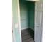 Open closet features neutral paint, plank flooring and wire shelving at 5152 Northridge Rd # 302, Sarasota, FL 34238