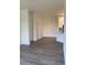 Open floor plan view of living room with hardwood floors, and view to kitchen at 5152 Northridge Rd # 302, Sarasota, FL 34238