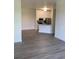 Open floor plan view of living room with hardwood floors, and view to kitchen at 5152 Northridge Rd # 302, Sarasota, FL 34238