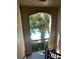 Great view of the sparkling pool from the stairwell with tropical landscaping at 5152 Northridge Rd # 302, Sarasota, FL 34238